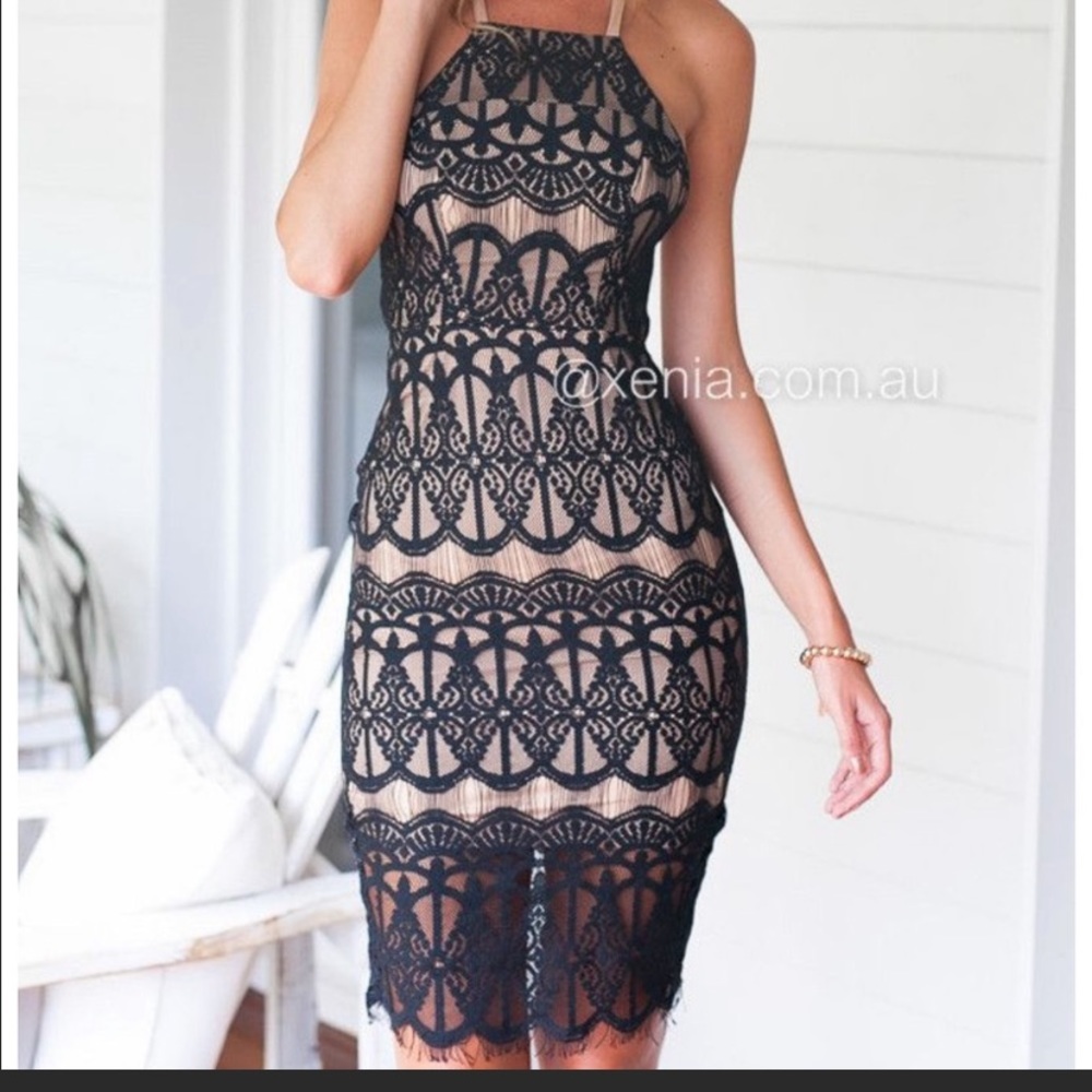 Lacy, strappy black cocktail dress.